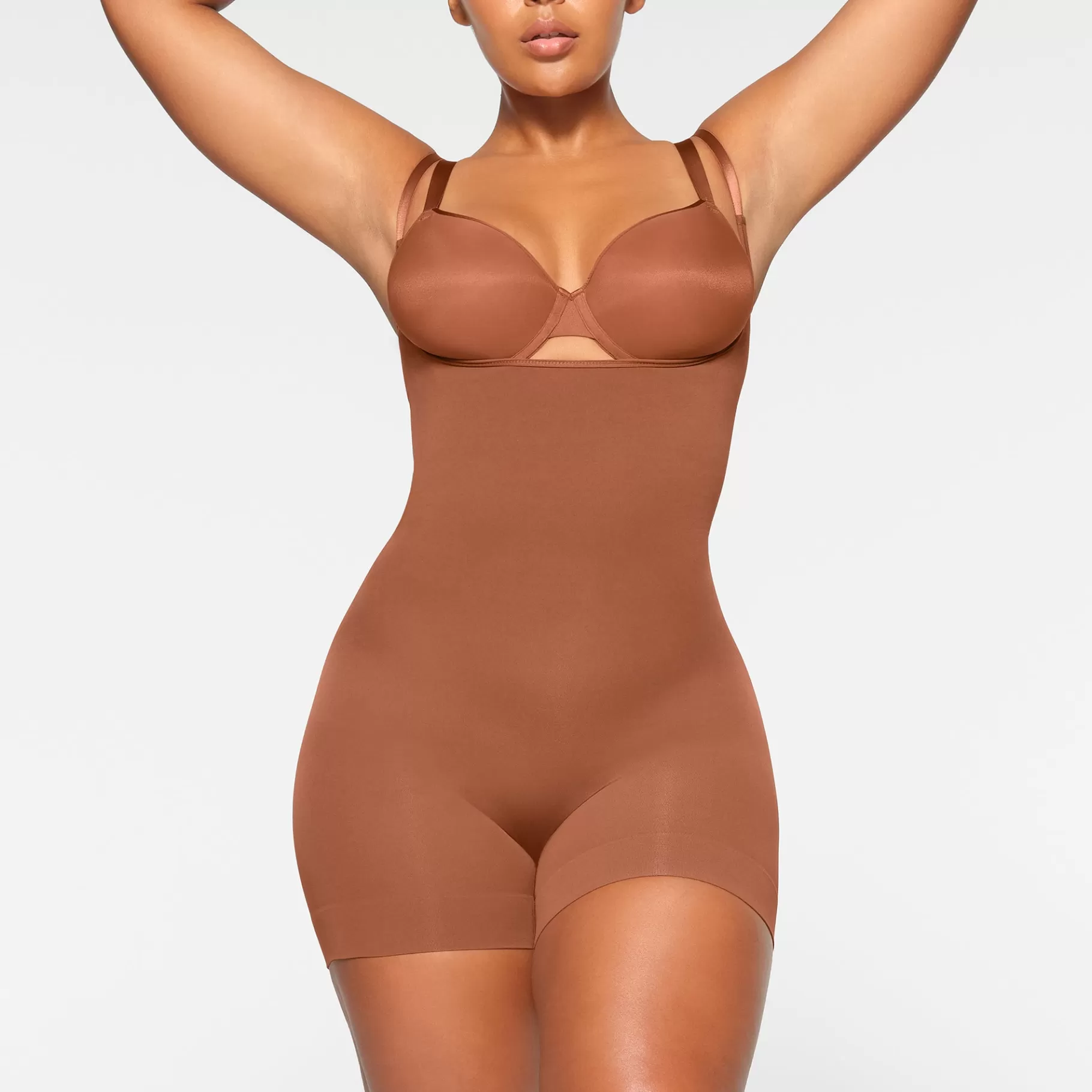 Skims seamless sculpt*SEAMLESS SCULPT OPEN BUST SHORTIE BODYSUIT | BRONZE