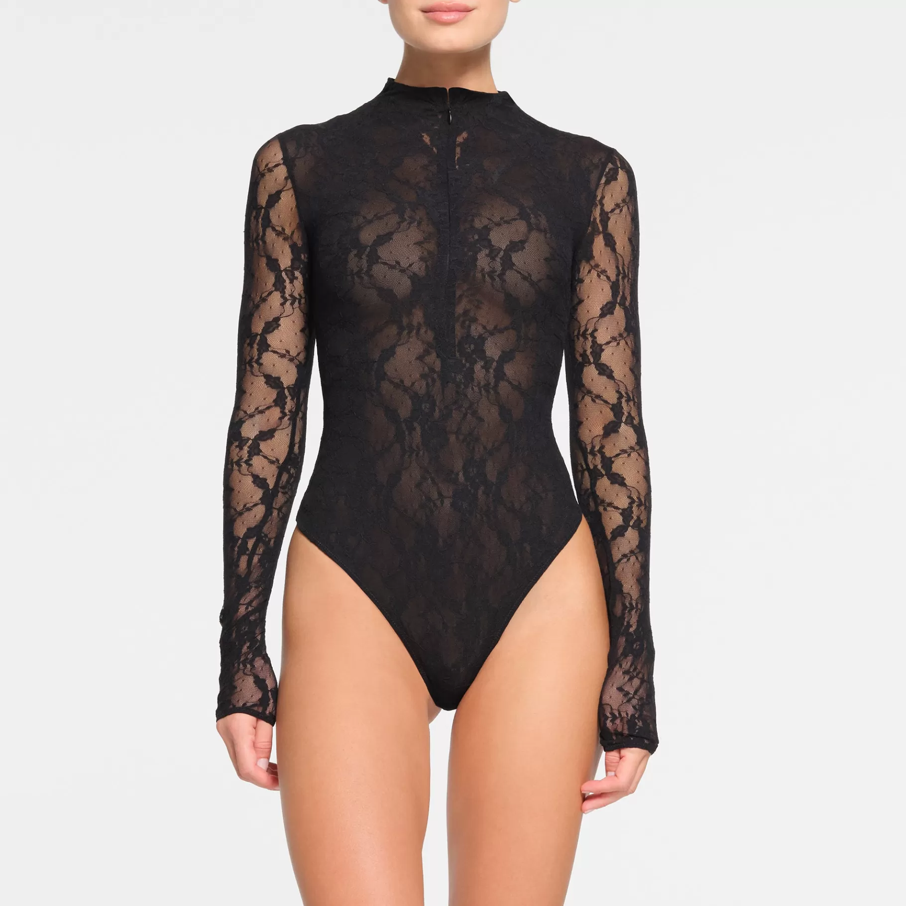 Skims bodysuits*STRETCH LACE LINED LONG SLEEVE THONG BODYSUIT | ONYX